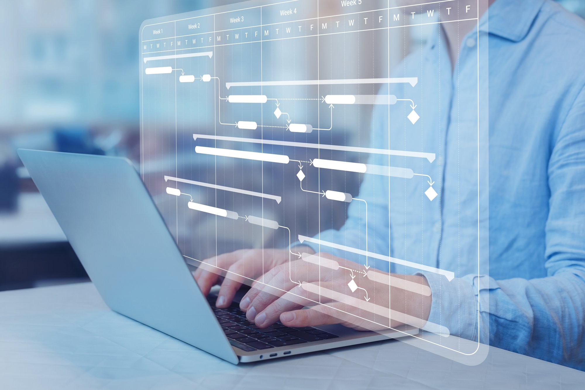 Person using a laptop with digital interface – eliminating asset data silos.