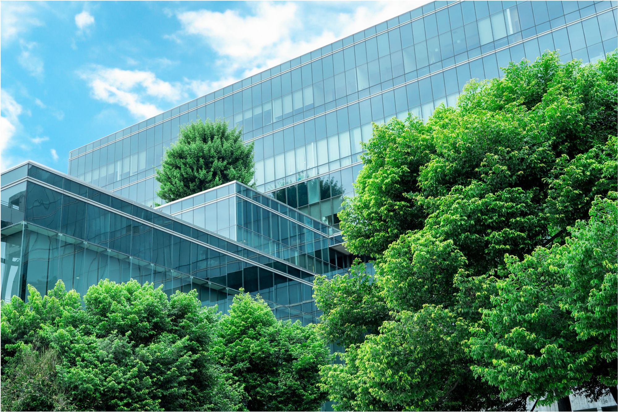 Modern smart city buildings with vertical gardens – representing sustainability and innovation.-p-2000