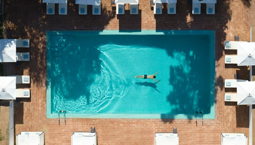 Aerial view of hotel pool – optimizing hospitality operations with sustainable asset management.