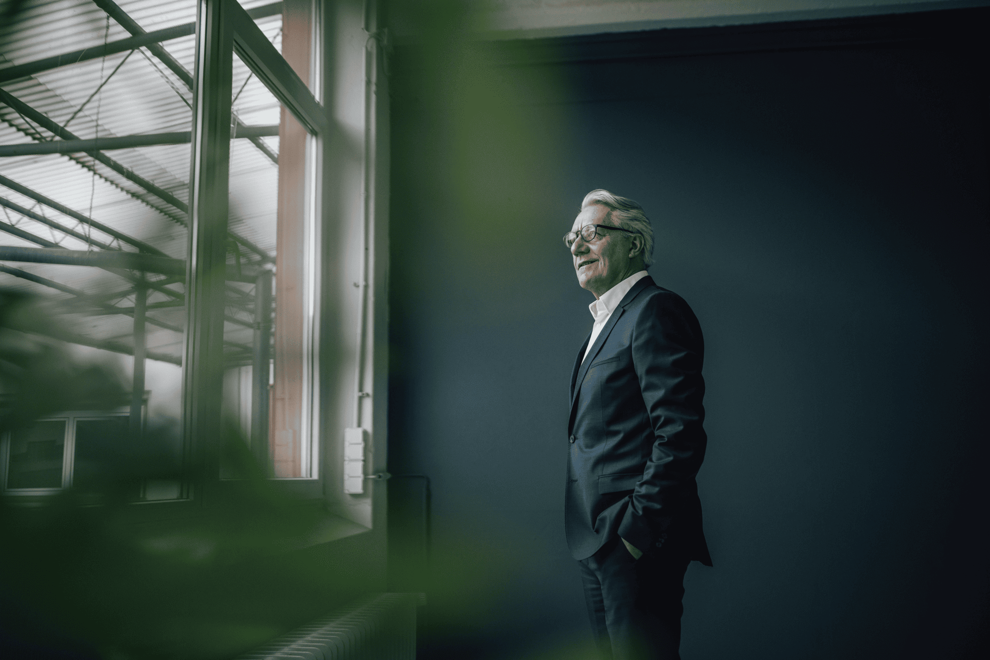 Businessman in a modern building – facility asset management for safe environments