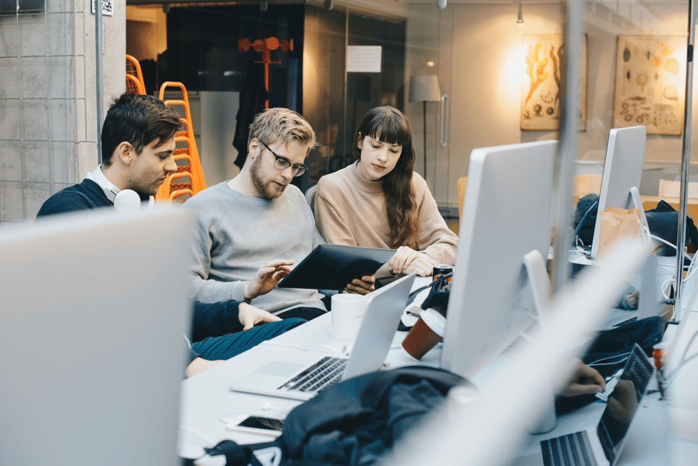 Team working in shared office – avoiding disruptions with proactive maintenance.